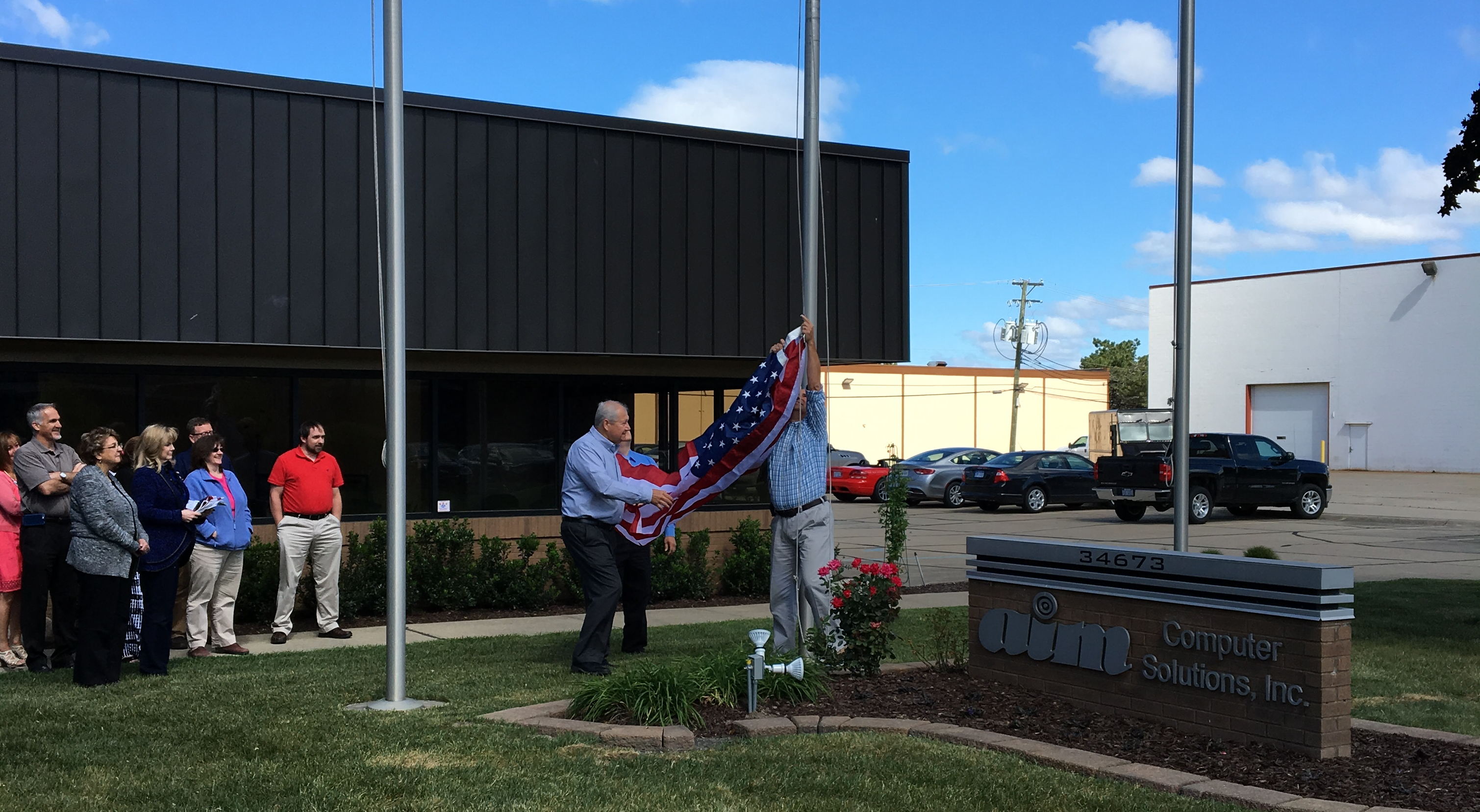 AIM building flag raising